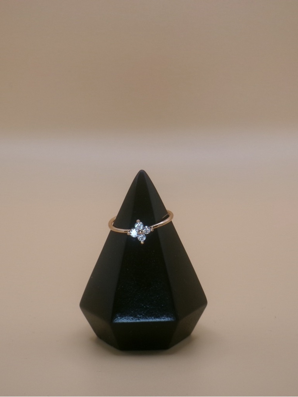 Delicate Golden Ring with Four-Stone Sparkle